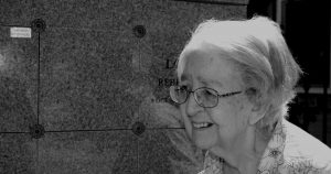 Elderly women mourns a loved one