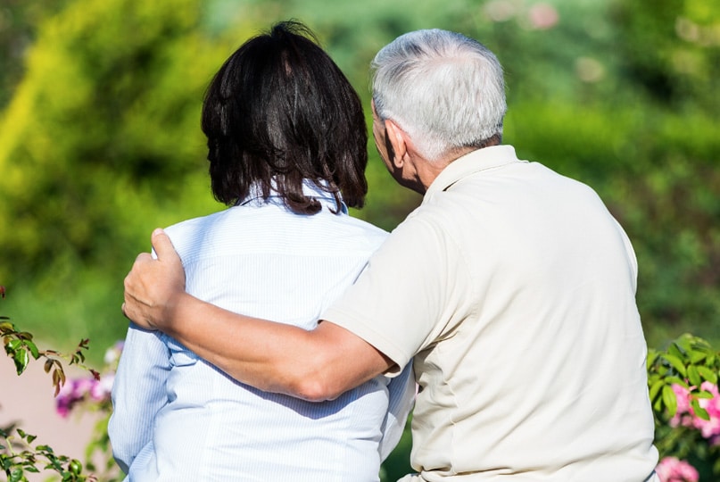 people grieving at a cemetery