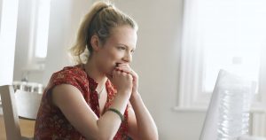 woman watching online funeral