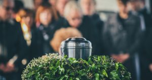 funeral attendees near urn