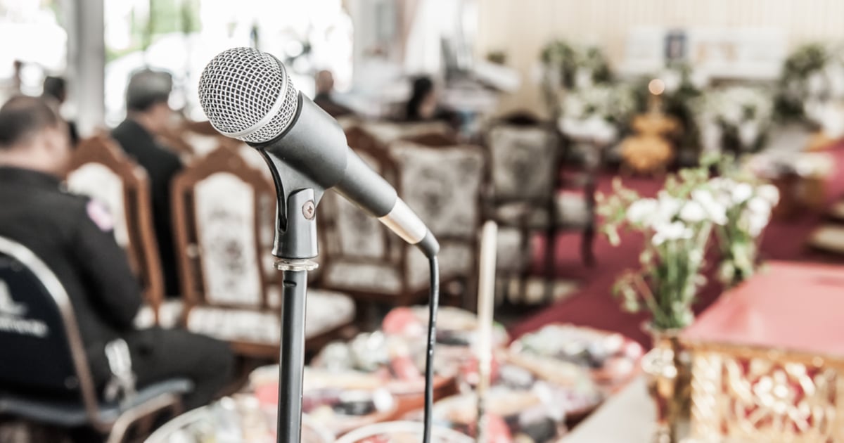 A microphone in a stand at a funeral service.