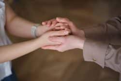 Two people holding hands.
