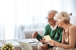 An elderly couple pre-planning their cremation.